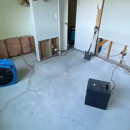 Air mover running in a room during a dry out after a water leak