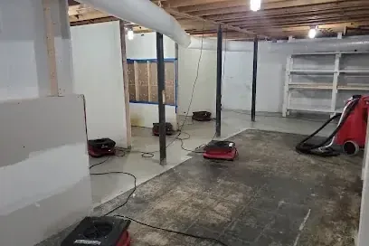Standing water across a lower level after a sump pump stopped